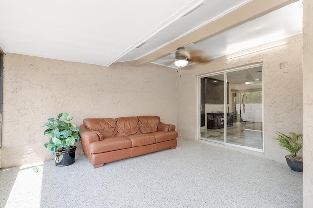 1406 Valley Pl, Brandon, FL 33510 - living area with speckled floor, ceiling fan, and a textured wall