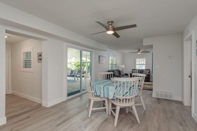 2271 Carolyn Dr, Dunedin, FL 34698 - dining space with a ceiling fan, light wood-style flooring, and baseboards