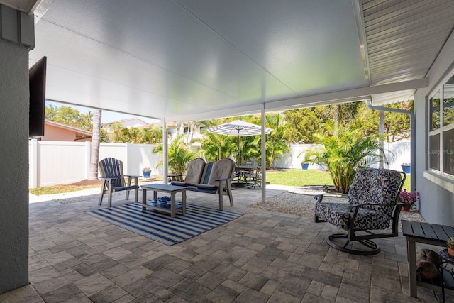 2271 Carolyn Dr, Dunedin, FL 34698 - fenced backyard with a patio area