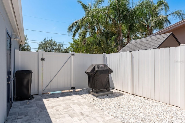 2271 Carolyn Dr, Dunedin, FL 34698 - view of patio featuring a gate and area for grilling