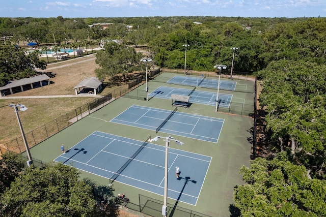 2271 Carolyn Dr, Dunedin, FL 34698 - view of tennis court featuring a forest view