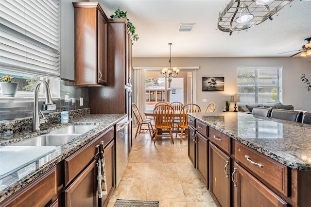 1524 Rhodeswell Ln, Dover, FL 33527 - kitchen featuring a sink, plenty of natural light, and hanging light fixtures