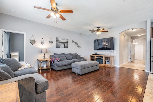 1524 Rhodeswell Ln, Dover, FL 33527 - living area with a ceiling fan, hardwood / wood-style flooring, arched walkways, and baseboards