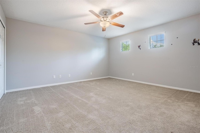 1524 Rhodeswell Ln, Dover, FL 33527 - unfurnished room featuring a ceiling fan, carpet floors, and baseboards