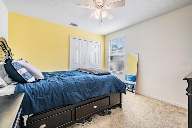 1524 Rhodeswell Ln, Dover, FL 33527 - bedroom with light colored carpet, a closet, ceiling fan, and baseboards