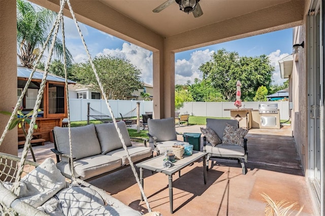 1524 Rhodeswell Ln, Dover, FL 33527 - fenced backyard with an outdoor living space, a ceiling fan, a patio, and area for grilling