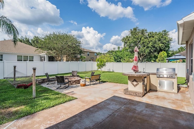 1524 Rhodeswell Ln, Dover, FL 33527 - view of patio / terrace with a fire pit