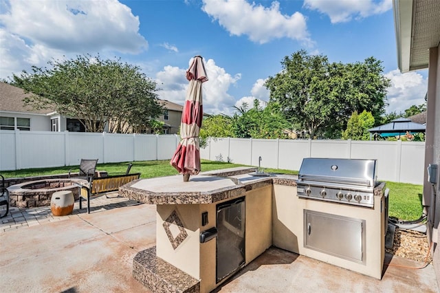 1524 Rhodeswell Ln, Dover, FL 33527 - view of patio / terrace with an outdoor fire pit and a sink
