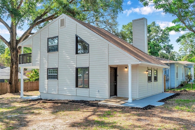 8521 N 29th St, Tampa, FL 33604 - rear view of property featuring a chimney