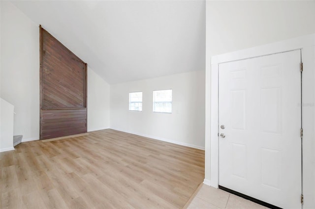 8521 N 29th St, Tampa, FL 33604 - additional living space featuring vaulted ceiling, light wood-style flooring, and baseboards