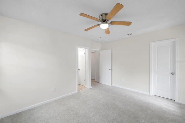 8521 N 29th St, Tampa, FL 33604 - unfurnished bedroom featuring light colored carpet, baseboards, and ceiling fan