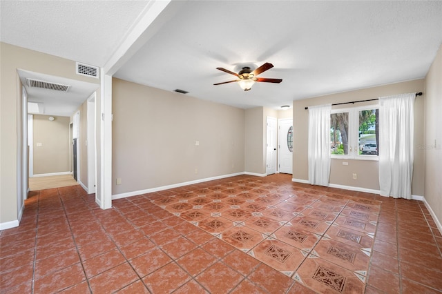 320 Tallahassee Dr NE, Saint Petersburg, FL 33702 - empty room with ceiling fan, light tile patterned flooring, and baseboards