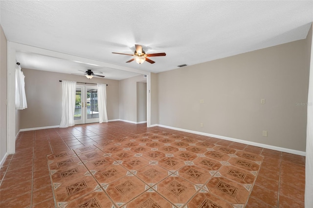 320 Tallahassee Dr NE, Saint Petersburg, FL 33702 - unfurnished room with a ceiling fan, baseboards, light tile patterned flooring, and a textured ceiling