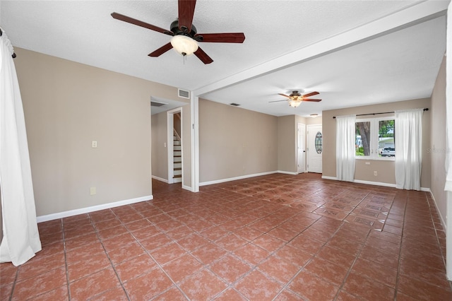 320 Tallahassee Dr NE, Saint Petersburg, FL 33702 - tiled empty room featuring a ceiling fan, stairs, and baseboards