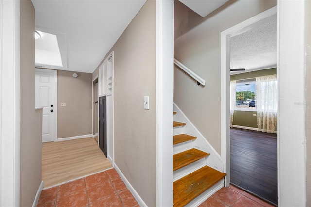 320 Tallahassee Dr NE, Saint Petersburg, FL 33702 - stairs with tile patterned flooring and baseboards