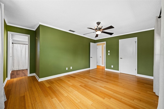 320 Tallahassee Dr NE, Saint Petersburg, FL 33702 - unfurnished bedroom with baseboards, crown molding, light wood-style flooring, and ceiling fan