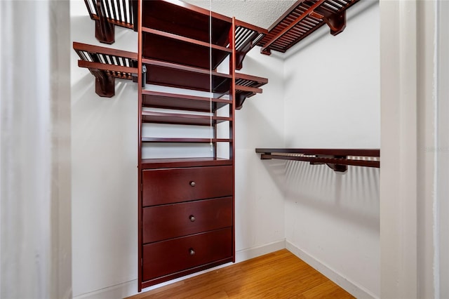 320 Tallahassee Dr NE, Saint Petersburg, FL 33702 - walk in closet with wood finished floors