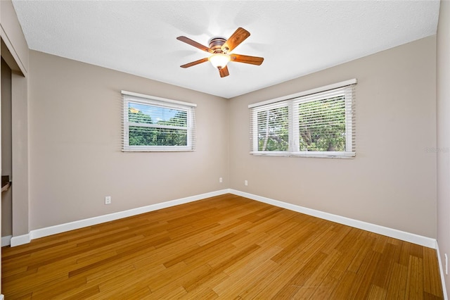 320 Tallahassee Dr NE, Saint Petersburg, FL 33702 - spare room featuring baseboards, light wood-style flooring, and a ceiling fan