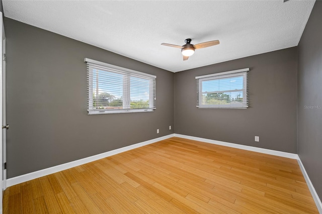 320 Tallahassee Dr NE, Saint Petersburg, FL 33702 - unfurnished room featuring light wood finished floors, a ceiling fan, and baseboards