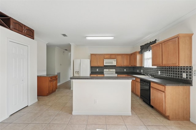 442 Graystone Blvd, Davenport, FL 33837 - kitchen with white appliances, crown molding, a sink, tasteful backsplash, and light tile patterned flooring