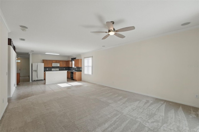 442 Graystone Blvd, Davenport, FL 33837 - unfurnished living room featuring light carpet, a ceiling fan, baseboards, and ornamental molding