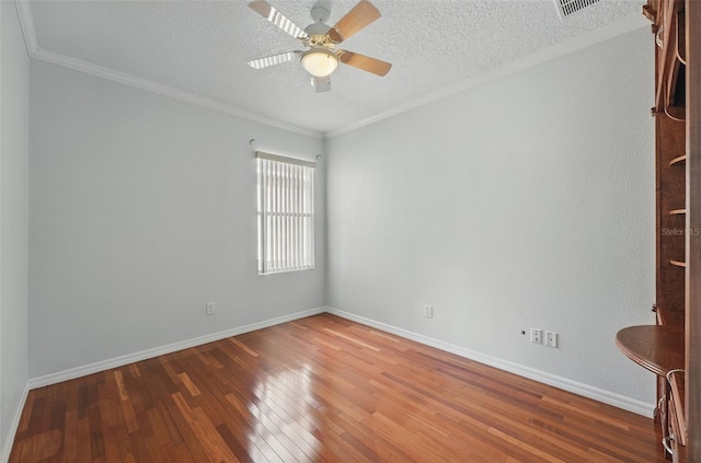 442 Graystone Blvd, Davenport, FL 33837 - empty room featuring a ceiling fan, wood-type flooring, baseboards, a textured ceiling, and ornamental molding