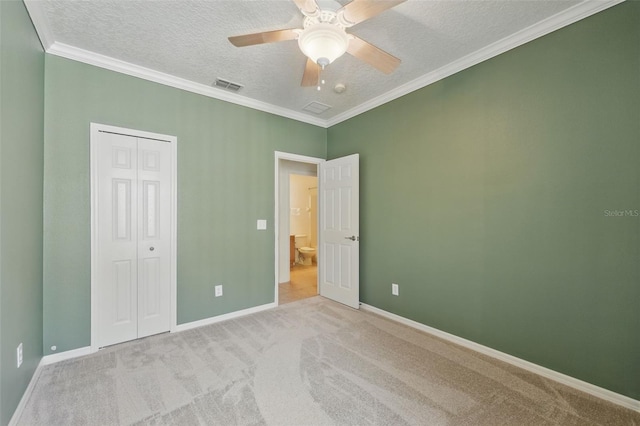 442 Graystone Blvd, Davenport, FL 33837 - unfurnished bedroom featuring a textured ceiling, carpet flooring, a closet, baseboards, and ornamental molding
