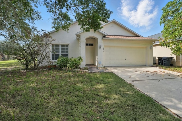 442 Graystone Blvd, Davenport, FL 33837 - view of front of house with stucco siding, an attached garage, concrete driveway, and a front lawn
