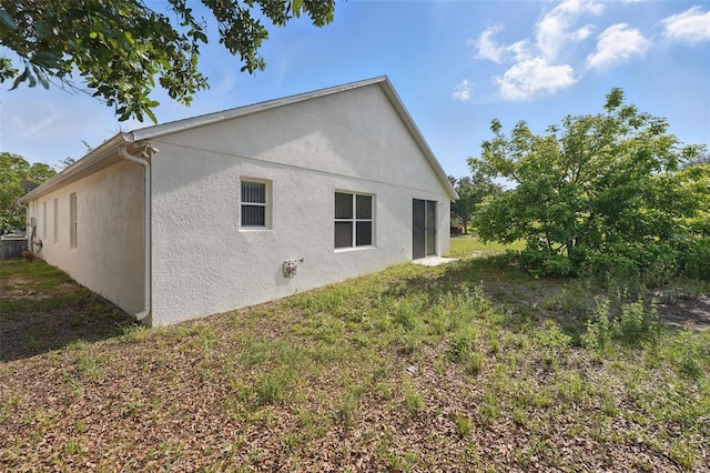 442 Graystone Blvd, Davenport, FL 33837 - back of house featuring stucco siding
