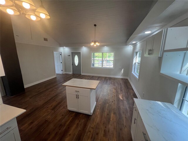 18127 US Highway 41, Spring Hill, FL 34610 - kitchen featuring a chandelier, open floor plan, dark wood-style floors, white cabinets, and ornamental molding
