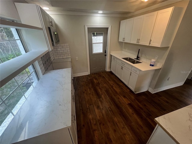 18127 US Highway 41, Spring Hill, FL 34610 - kitchen featuring a sink, dark wood-style floors, baseboards, white cabinets, and ornamental molding