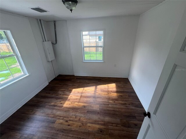 18127 US Highway 41, Spring Hill, FL 34610 - unfurnished room with plenty of natural light, dark wood-style flooring, and baseboards