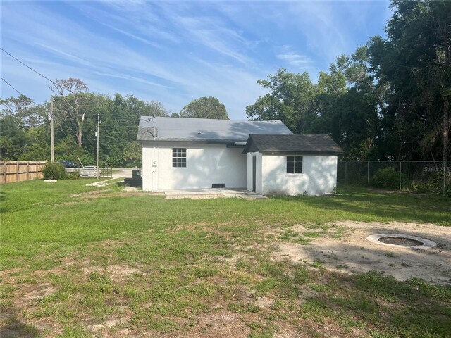 18127 US Highway 41, Spring Hill, FL 34610 - rear view of property with stucco siding
