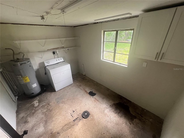 18127 US Highway 41, Spring Hill, FL 34610 - laundry area featuring washer / dryer, electric water heater, and cabinet space