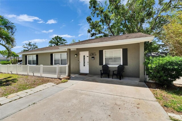 206 4th Ave NW, Ruskin, FL 33570 - view of front of home featuring a porch and stucco siding