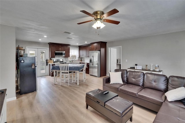 206 4th Ave NW, Ruskin, FL 33570 - living room featuring ceiling fan, light wood finished floors, recessed lighting, and baseboards