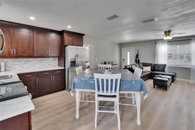206 4th Ave NW, Ruskin, FL 33570 - dining area with light wood-style floors, ceiling fan, baseboards, and recessed lighting