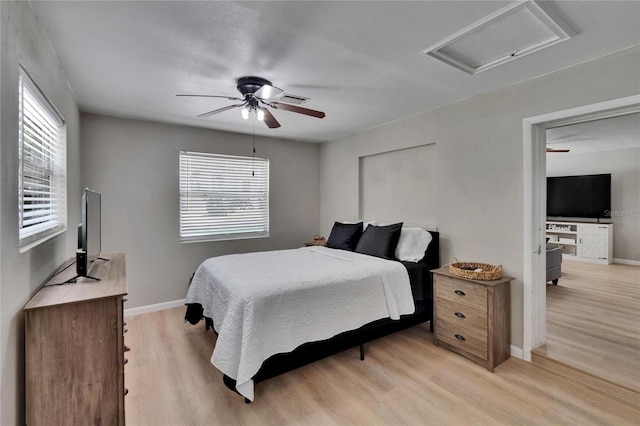 206 4th Ave NW, Ruskin, FL 33570 - bedroom with attic access, light wood finished floors, and multiple windows
