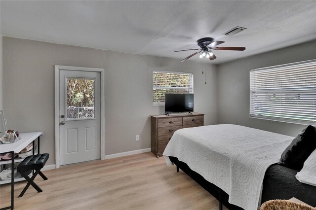 206 4th Ave NW, Ruskin, FL 33570 - bedroom featuring light wood-style flooring, baseboards, and a ceiling fan