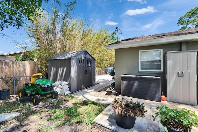 206 4th Ave NW, Ruskin, FL 33570 - fenced backyard with a jacuzzi and a patio area
