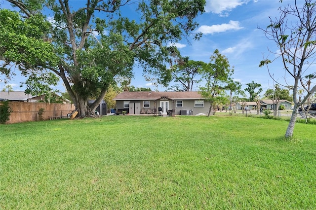 206 4th Ave NW, Ruskin, FL 33570 - back of house featuring central air condition unit
