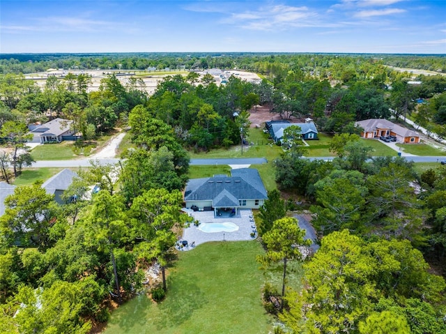 10197 Meadow Wren Ave, Weeki Wachee, FL 34613 - aerial view of property's location with a pool, a tree filled landscape, and nearby suburban area