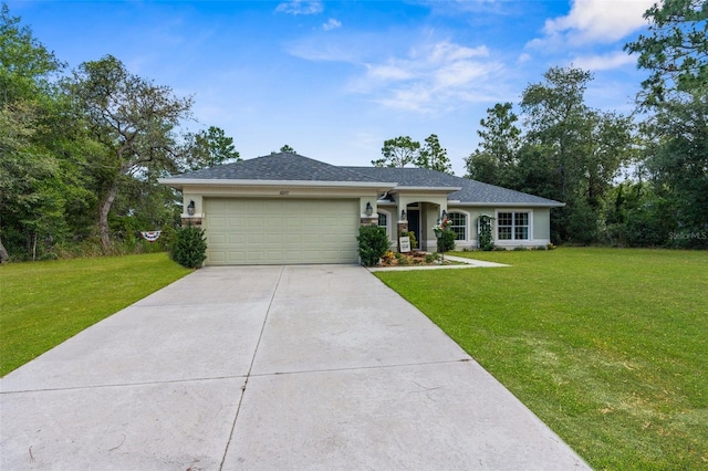 10197 Meadow Wren Ave, Weeki Wachee, FL 34613 - single story home with a garage, driveway, and a front yard