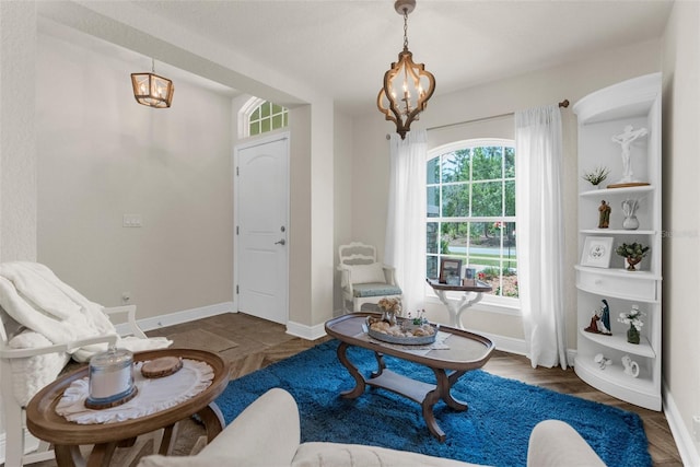 10197 Meadow Wren Ave, Weeki Wachee, FL 34613 - living room featuring a chandelier, baseboards, and wood finished floors