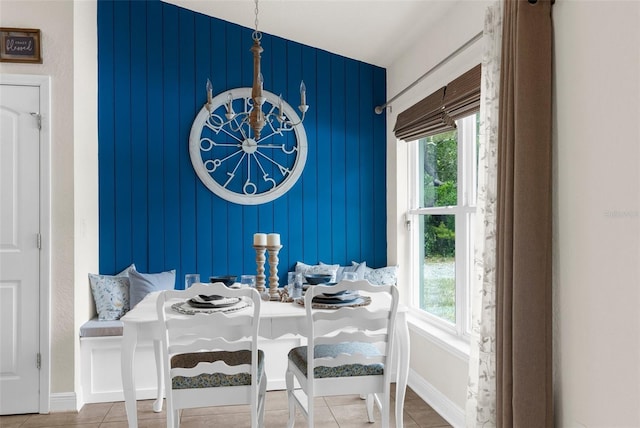 10197 Meadow Wren Ave, Weeki Wachee, FL 34613 - tiled dining space featuring healthy amount of natural light, a chandelier, and baseboards