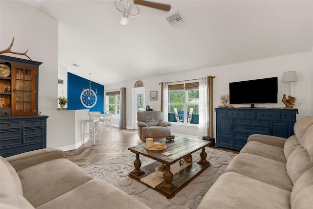 10197 Meadow Wren Ave, Weeki Wachee, FL 34613 - living room featuring lofted ceiling, baseboards, and a ceiling fan