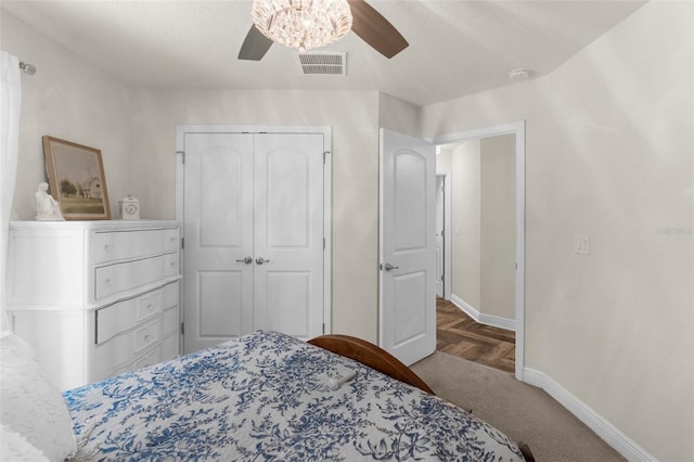 10197 Meadow Wren Ave, Weeki Wachee, FL 34613 - bedroom featuring baseboards, a closet, ceiling fan, and carpet