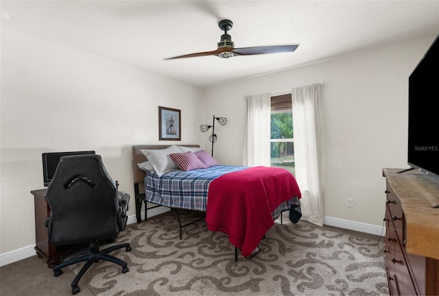 10197 Meadow Wren Ave, Weeki Wachee, FL 34613 - carpeted bedroom with baseboards and ceiling fan