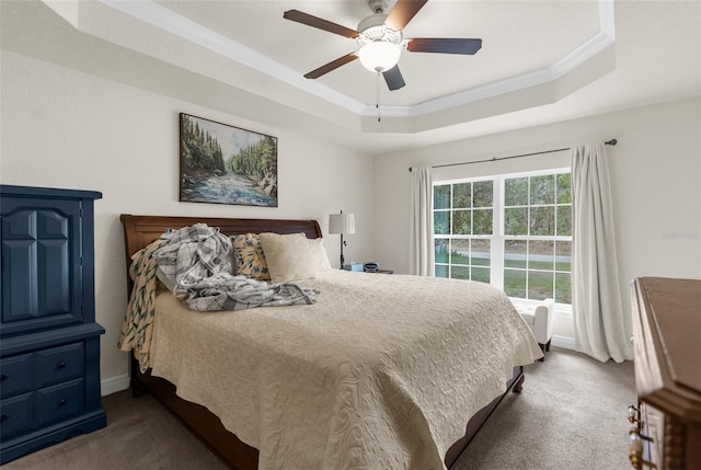 10197 Meadow Wren Ave, Weeki Wachee, FL 34613 - carpeted bedroom with a tray ceiling, ornamental molding, baseboards, and a ceiling fan