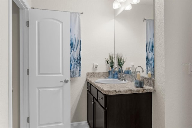 10197 Meadow Wren Ave, Weeki Wachee, FL 34613 - bathroom featuring vanity and a textured wall